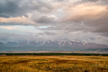 North Chuya Ridge in the early morning with the first rays of the sun. Kurai steppe. Altai Mountains, Russia.