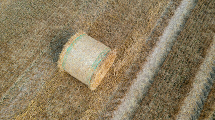 Aerial view of haystack in a farm field on a sunny august day.