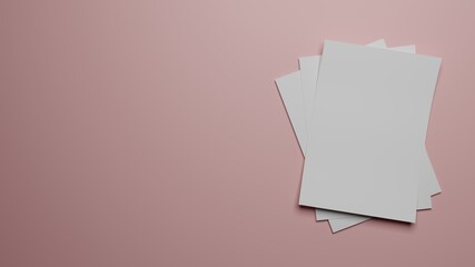 Blank white papers on a pink surface.