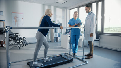 Hospital Physical Therapy: Strong Determined Senior Female Patient with Injury Walks on Treadmill Holding Parallel Bars. Physiotherapist, Rehabilitation Doctor Assist, Help Disabled Person to Heal
