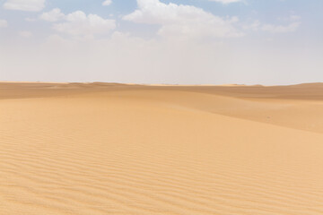 Fototapeta na wymiar senery of beautiful vast desert and sky with clouds in marib in yemen 