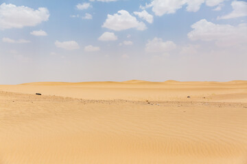 Fototapeta na wymiar senery of beautiful vast desert and sky with clouds in marib in yemen 