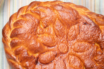 Freshly baked chiken pie on a wooden table.