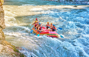 rafting on a large boat on a mountain river