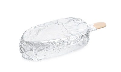 Ice cream bar wrapped in foil on white background