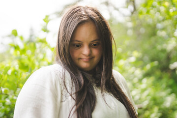 Portrait of trisomy adult outside having fun