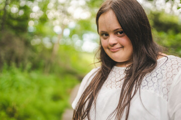 Portrait of trisomy adult outside having fun