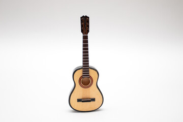 Acoustic Guitar Small miniature Toy on white background