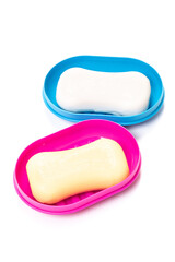 Travel soap in plastic soap dish isolated on white background