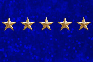 five gold foil star on blue background, concept of evaluating the result, rating, Satisfaction