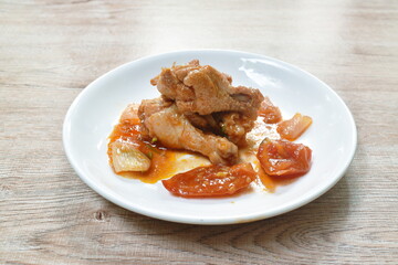 fried chicken drum wing with sweet and sour sauce and vegetable on plate
