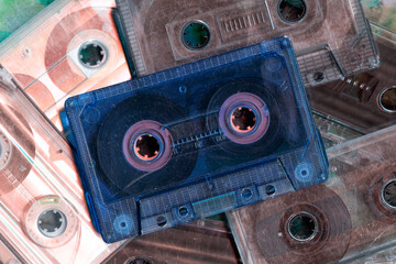 Vintage audio cassette tapes placed next to each other. Obsolete technology of audio recording and...