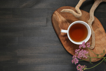 flower on a wooden background with tea