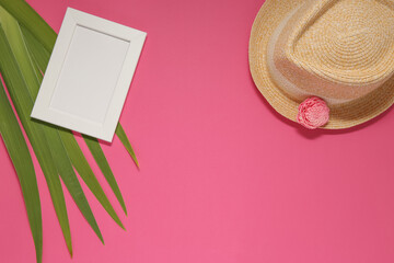vacation items on pink background