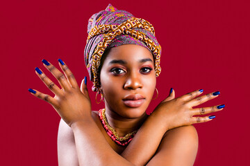 zanzibar african woman in turban and make up with blue nails