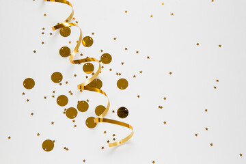 gold stars and tinsel on white background