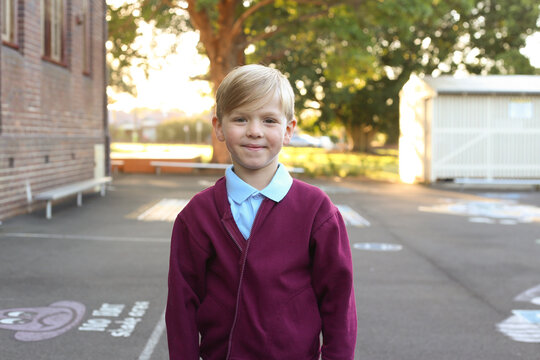 School Boy Smiling For The Camera In The Playground