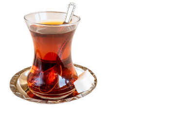Turkish tea with sugar cubes on white background