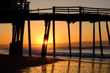 Storm battered broken down pier at sunrise on the Atlantic ocean off the North Carolina Coast