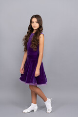 serious teen girl with long frizzy hair in dance ballroom dress full length, dancewear