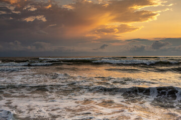 Charming sunset on the black sea beach in Georgia.