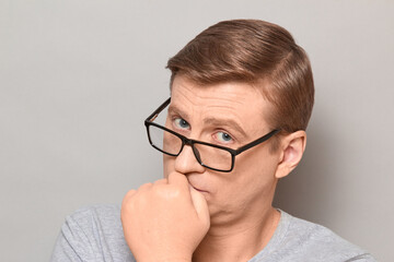 Portrait of serious thoughtful blond mature man with glasses