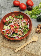 Fresh salad with cucumbers and tomatoes.