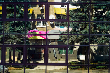 a glass building, a reflection in a window, a distorted world through a window