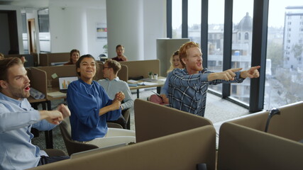 Fototapeta premium Business people celebrating success during work. Colleagues giving high five 