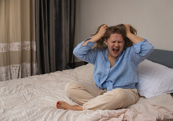 Fototapeta premium Woman stress alone, addict and alcoholism alone sad sitting on bed at home in depression. Concept mental health, emotional anxiety, panic attack. Sadness, loneliness, old age.