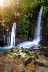 Curug cisanca. Beautiful waterfalls of Subang west java. vertical orientation for smartphone wallpaper. 