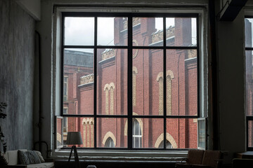Moscow, Russia - 10 July 2021, View through the factory window to the old Electrozavod factory