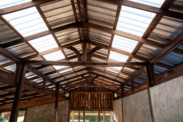 Under the translucent wooden roof structure on construction site