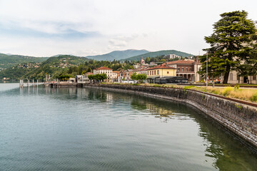 Fototapeta na wymiar Lakefront of the tourist town Luino on the shore of Lake Maggiore in province of Varese, Italy