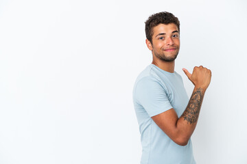 Young handsome Brazilian man isolated on white background proud and self-satisfied