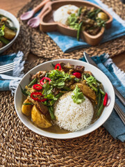 Beef Rendang curry, Thai food, home cooked meal, healthy dinner, Thai curry, spicy, rattan place mats, teal napkins, family meal