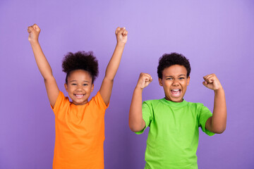 Photo of two young little african kids happy positive smile rejoice winner success isolated over violet color background - Powered by Adobe