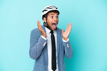Young business Brazilian man with bike helmet isolated on blue background with surprise facial expression