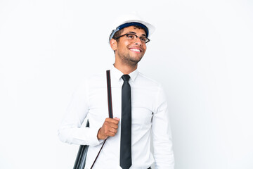 Architect brazilian man with helmet and holding blueprints thinking an idea while looking up