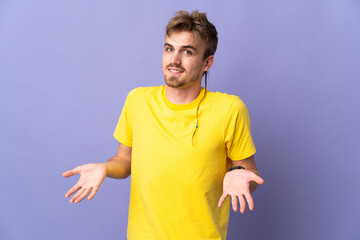 Young handsome blonde man isolated on purple background happy and smiling