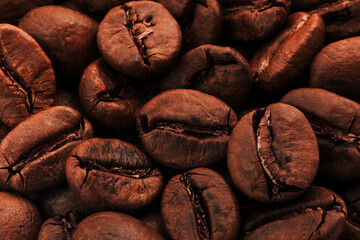 Natural brown coffee beans background. Macro.