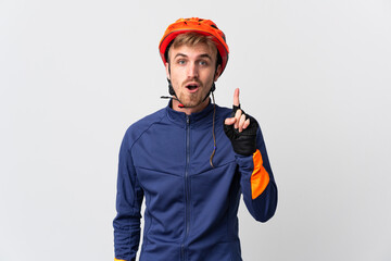 Young cyclist blonde man isolated on white background intending to realizes the solution while...