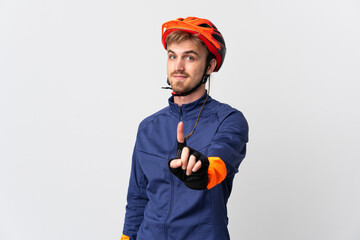 Young cyclist blonde man isolated on white background showing and lifting a finger