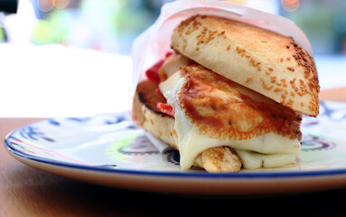 Traditional delicious sandwich, called as Kumru in Turkish, snack with rich ingredients. Special sesame bread sandwich.