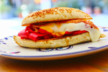 Traditional delicious sandwich, called as Kumru in Turkish, snack with rich ingredients. Special sesame bread sandwich.