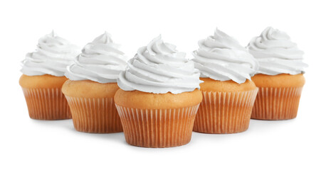 Delicious cupcakes decorated with cream on white background