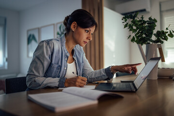 Woman working at home. Problem solving while working overtime.