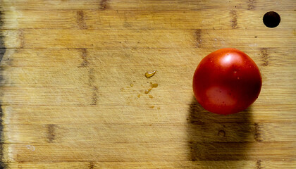 Red ripe tomato on a cutting board