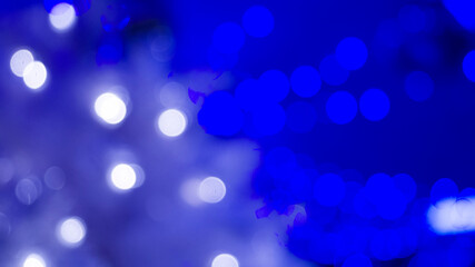 Blurred background with glowing lights. Festive mood