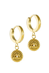 Golden earrings with protection symbol isolated on a white background.